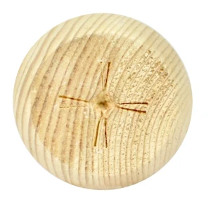 Detailansicht des runden Möbelfußes aus Kiefernholz mit natürlicher Holzmaserung