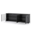 Detailansicht des grifflosen Push-to-Open-Systems am schwarzen TV Schrank.